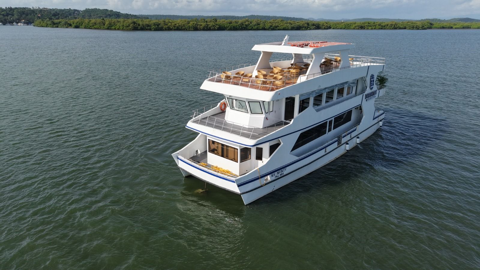 Infinity cruise catamaran with open top deck on the Mandovi river